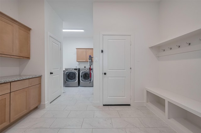 2610 Texas Orange Trl, Richmond, TX 77406 - laundry room featuring separate washer and dryer, cabinet space, and light marble finish flooring