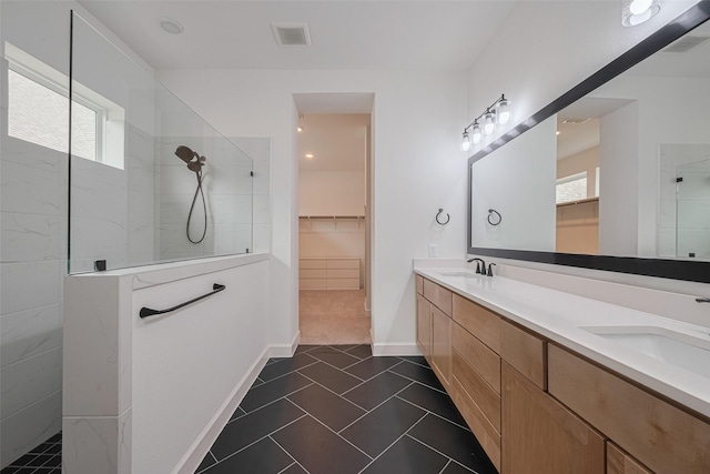 2610 Texas Orange Trl, Richmond, TX 77406 - full bath featuring a walk in shower, healthy amount of natural light, tile patterned floors, and double vanity