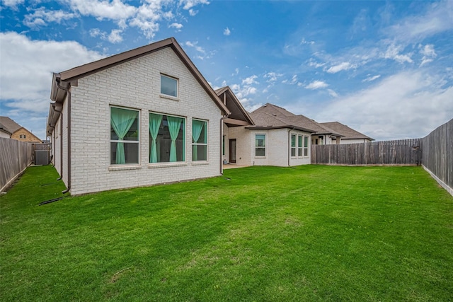 2610 Texas Orange Trl, Richmond, TX 77406 - back of house with brick siding and central AC