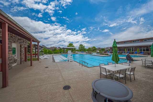 2610 Texas Orange Trl, Richmond, TX 77406 - community pool featuring a patio area