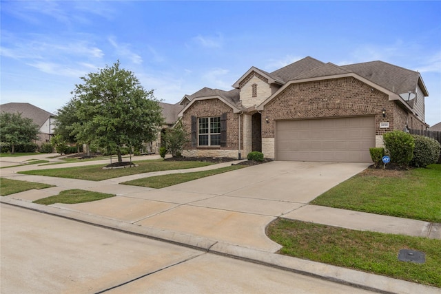 24730 Harbor Terrace Ln, Richmond, TX 77406 - view of front facade featuring brick siding, a garage, concrete driveway, and a front lawn