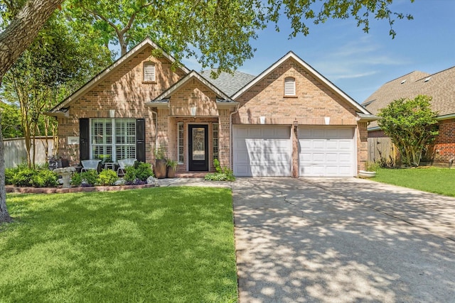8514 Babbling Brook Ct, Sugar Land, TX 77479 - traditional-style home with a garage, brick siding, and concrete driveway