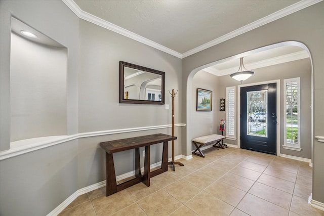 8514 Babbling Brook Ct, Sugar Land, TX 77479 - entryway with arched walkways, ornamental molding, light tile patterned floors, and baseboards