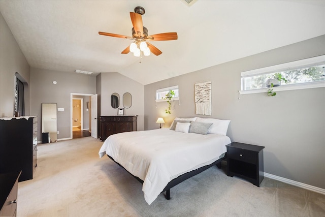 8514 Babbling Brook Ct, Sugar Land, TX 77479 - bedroom with light carpet, baseboards, multiple windows, vaulted ceiling, and a ceiling fan