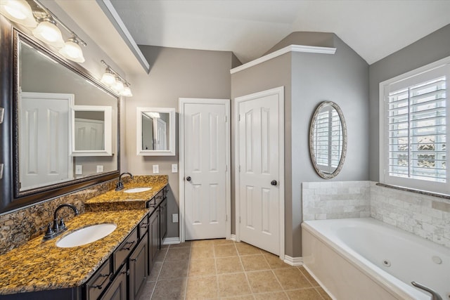 8514 Babbling Brook Ct, Sugar Land, TX 77479 - full bath featuring tile patterned flooring, lofted ceiling, a jetted tub, double vanity, and baseboards