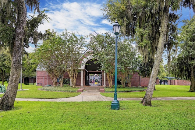 8514 Babbling Brook Ct, Sugar Land, TX 77479 - obstructed view of property with brick siding and a front yard