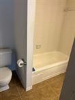 3100 Walnut Bend Ln Unit 508, Houston, TX 77042 - full bathroom with toilet and tile patterned flooring