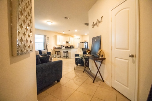 7735 Nevaeh Crest Path, Houston, TX 77016 - living room featuring light tile patterned floors