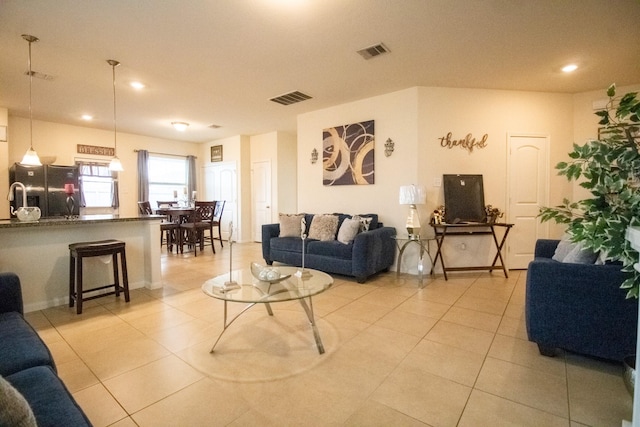 7735 Nevaeh Crest Path, Houston, TX 77016 - living area with light tile patterned flooring and recessed lighting