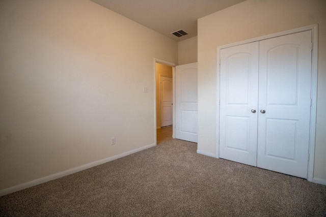 7735 Nevaeh Crest Path, Houston, TX 77016 - unfurnished bedroom featuring carpet, baseboards, and a closet