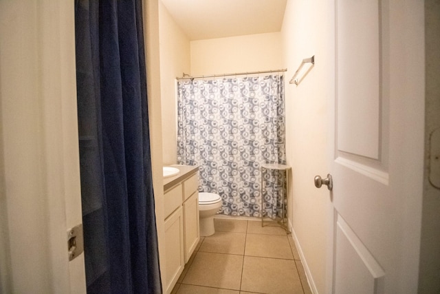 7735 Nevaeh Crest Path, Houston, TX 77016 - full bathroom with toilet, vanity, tile patterned flooring, a shower with shower curtain, and baseboards