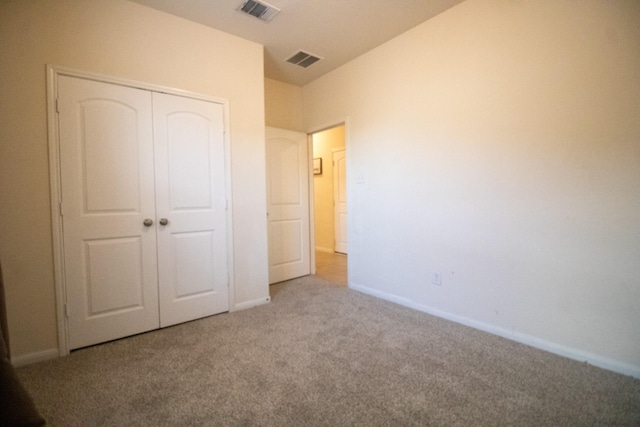 7735 Nevaeh Crest Path, Houston, TX 77016 - unfurnished bedroom featuring carpet flooring, a closet, and baseboards