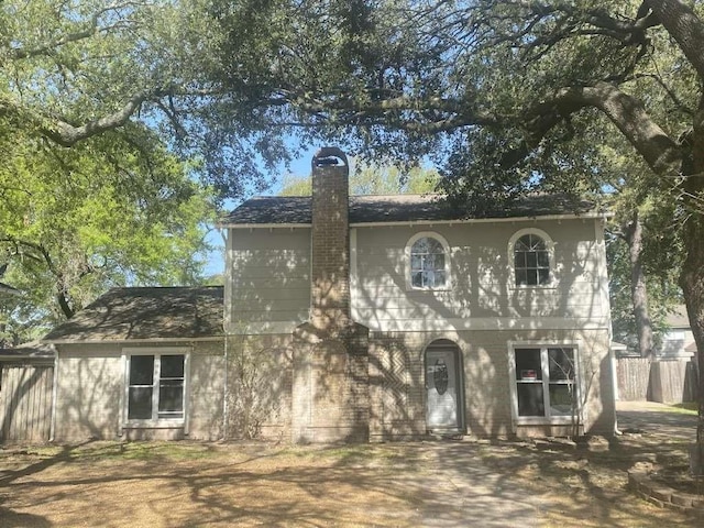 4906 Havenwoods Dr, Houston, TX 77066 - view of front of home featuring a chimney and fence