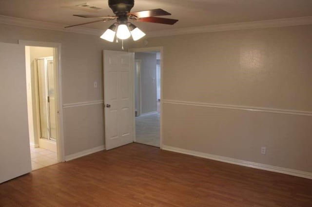 4906 Havenwoods Dr, Houston, TX 77066 - spare room featuring wood finished floors, ceiling fan, crown molding, and baseboards