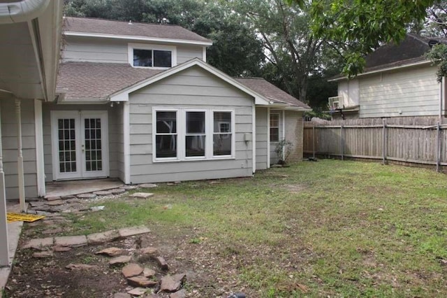 4906 Havenwoods Dr, Houston, TX 77066 - back of house with french doors and a shingled roof