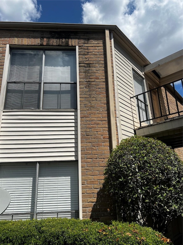 3724 Woodchase Dr Unit 3724, Houston, TX 77042 - view of side of property featuring a balcony and brick siding