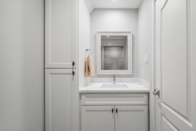 bathroom with vanity and a shower