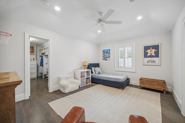 bedroom featuring a spacious closet, dark wood finished floors, recessed lighting, a ceiling fan, and baseboards