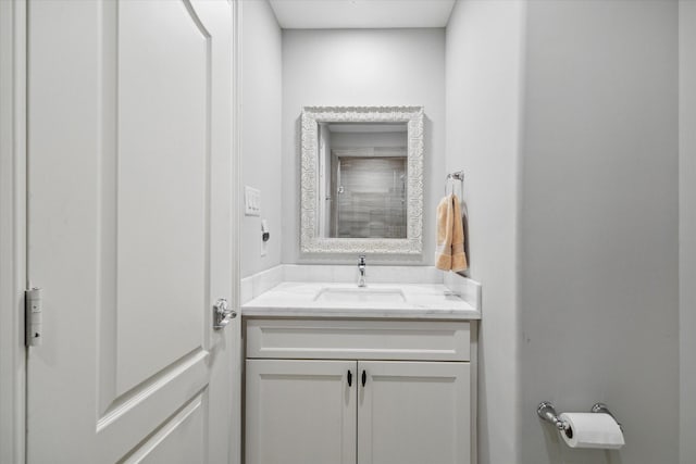 bathroom featuring vanity and a shower