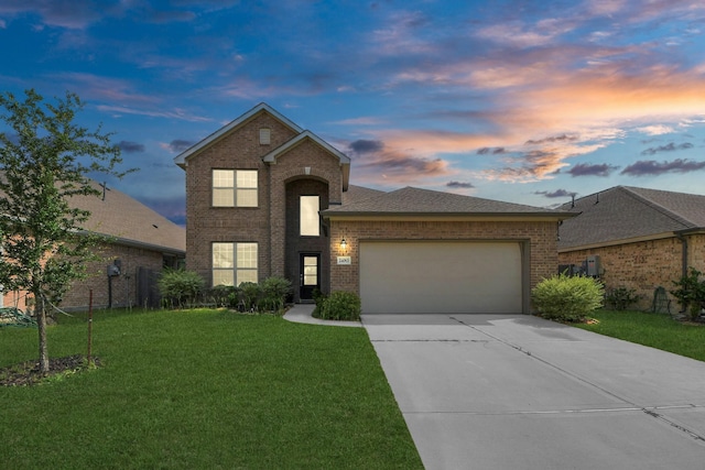 24063 Hawthorn Lakes Dr, New Caney, TX 77357 - traditional-style house with brick siding, a garage, a front lawn, and driveway