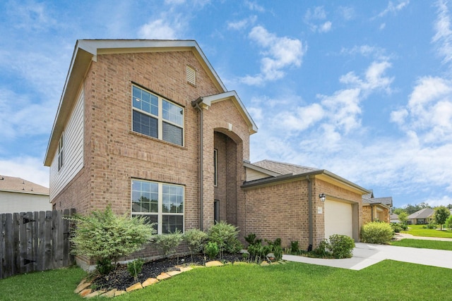 24063 Hawthorn Lakes Dr, New Caney, TX 77357 - traditional home featuring brick siding, concrete driveway, and a garage