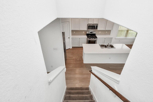 24063 Hawthorn Lakes Dr, New Caney, TX 77357 - stairway with wood finished floors