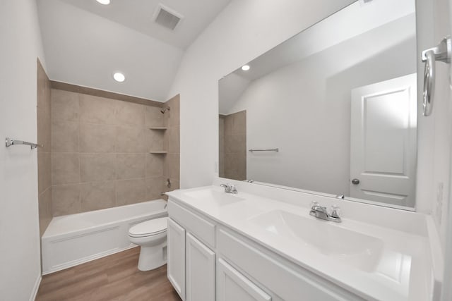 24063 Hawthorn Lakes Dr, New Caney, TX 77357 - bathroom featuring wood finished floors, toilet, double vanity, shower / washtub combination, and recessed lighting