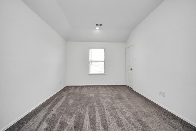 24063 Hawthorn Lakes Dr, New Caney, TX 77357 - spare room with carpet flooring, baseboards, and lofted ceiling