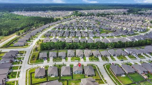 24063 Hawthorn Lakes Dr, New Caney, TX 77357 - aerial view of property's location featuring nearby suburban area and a heavily wooded area