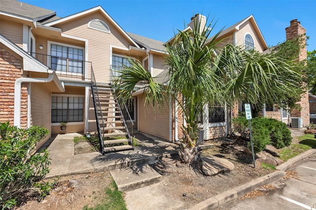 2300 Old Spanish Trl Unit 2059, Houston, TX 77054 - view of property featuring stairs and central AC