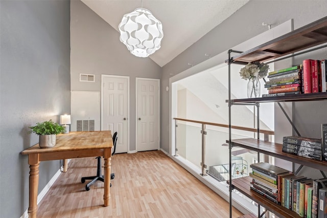 2300 Old Spanish Trl Unit 2059, Houston, TX 77054 - home office with light wood-style floors, baseboards, and high vaulted ceiling