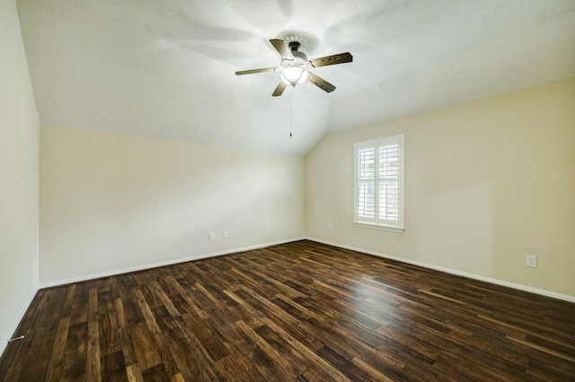 24635 Blue Opal Ln, Katy, TX 77494 - additional living space featuring vaulted ceiling, a ceiling fan, dark wood-style floors, and baseboards