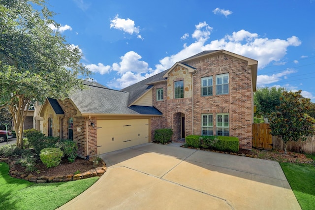 24635 Blue Opal Ln, Katy, TX 77494 - traditional-style home featuring brick siding, an attached garage, roof with shingles, and concrete driveway