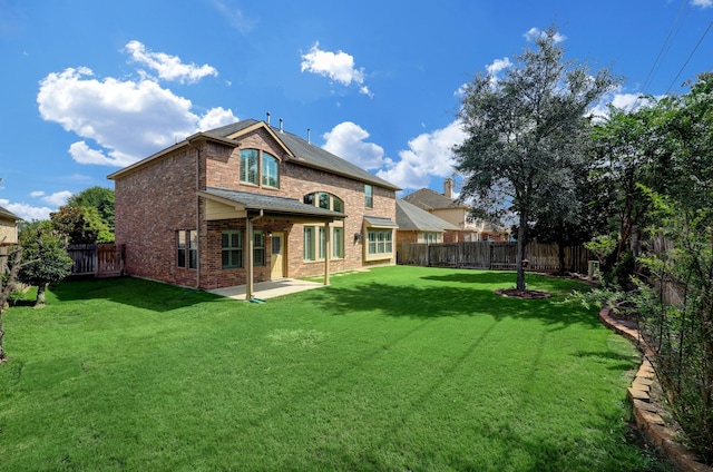 24635 Blue Opal Ln, Katy, TX 77494 - back of property featuring brick siding and a patio area