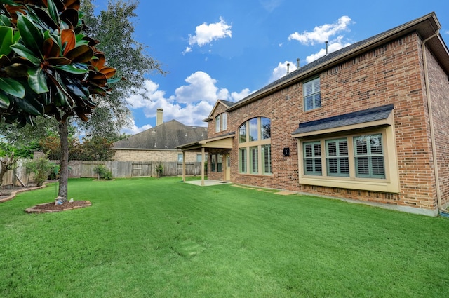 24635 Blue Opal Ln, Katy, TX 77494 - rear view of property with brick siding and a patio