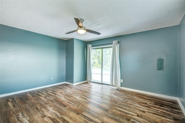 55 Willow Ct, Lake Jackson, TX 77566 - spare room featuring wood finished floors, ceiling fan, baseboards, electric panel, and a textured ceiling