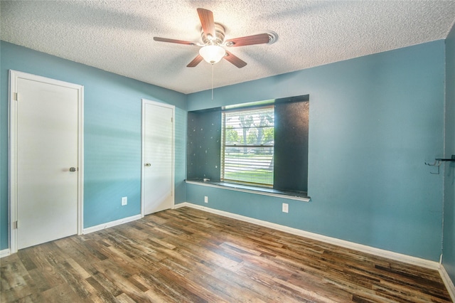55 Willow Ct, Lake Jackson, TX 77566 - spare room featuring a textured ceiling, a ceiling fan, wood finished floors, and baseboards