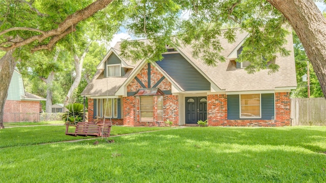 55 Willow Ct, Lake Jackson, TX 77566 - tudor-style house with brick siding