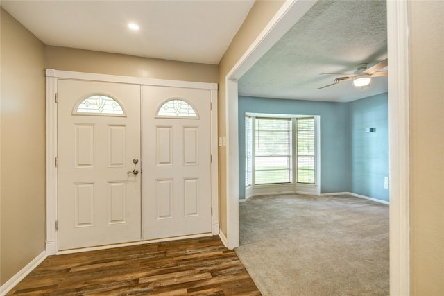 55 Willow Ct, Lake Jackson, TX 77566 - entrance foyer with baseboards, dark wood-type flooring, and a ceiling fan
