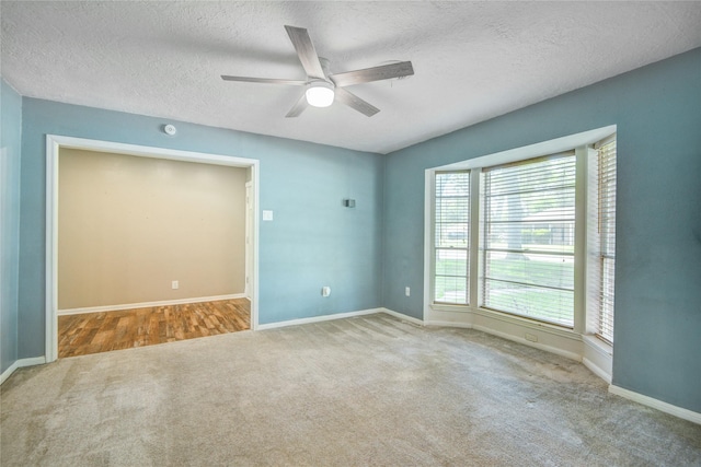 55 Willow Ct, Lake Jackson, TX 77566 - empty room with carpet floors, a ceiling fan, a textured ceiling, and baseboards