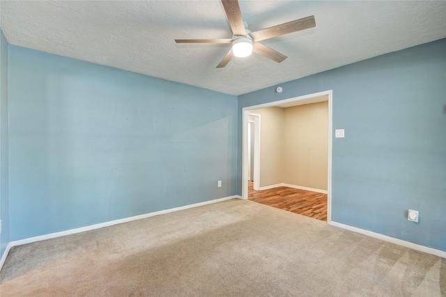 55 Willow Ct, Lake Jackson, TX 77566 - empty room with carpet, a ceiling fan, a textured ceiling, and baseboards
