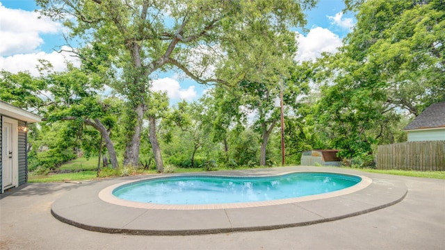 55 Willow Ct, Lake Jackson, TX 77566 - view of pool featuring a patio and view of wooded area