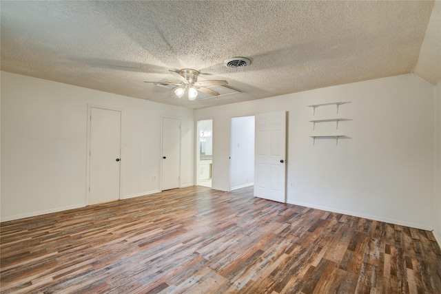 55 Willow Ct, Lake Jackson, TX 77566 - unfurnished bedroom featuring wood finished floors, a textured ceiling, ensuite bath, a ceiling fan, and baseboards