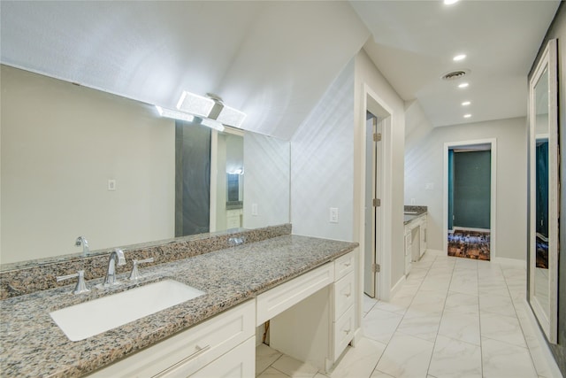 55 Willow Ct, Lake Jackson, TX 77566 - bathroom featuring marble look tiles, vanity, recessed lighting, and baseboards