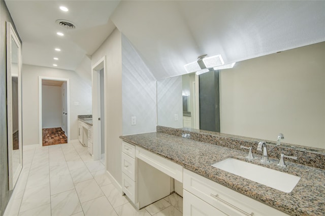 55 Willow Ct, Lake Jackson, TX 77566 - bathroom featuring marble look tiles, baseboards, vanity, and recessed lighting