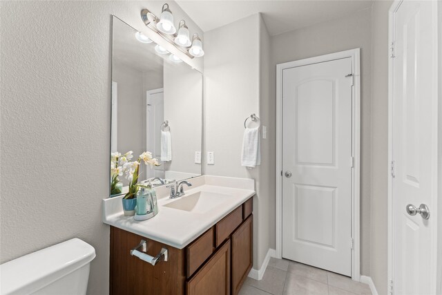 14818 Autumn Long Trl, Humble, TX 77396 - bathroom with vanity, toilet, tile patterned floors, and baseboards