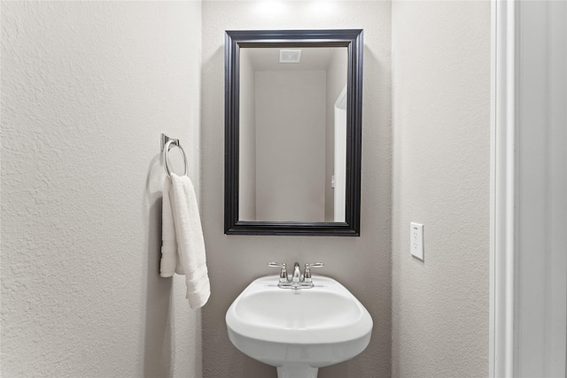 14818 Autumn Long Trl, Humble, TX 77396 - bathroom featuring a textured wall and a sink