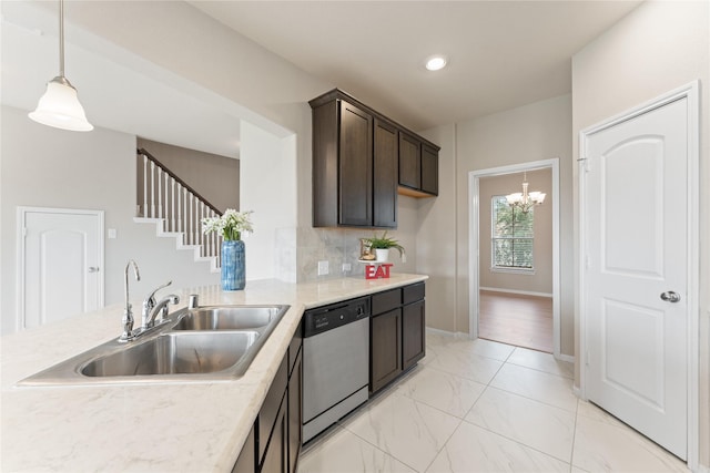 14818 Autumn Long Trl, Humble, TX 77396 - kitchen with stainless steel dishwasher, a sink, dark brown cabinetry, a chandelier, and pendant lighting