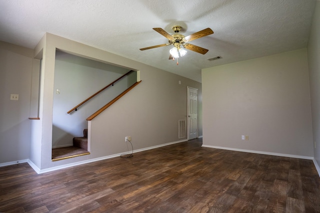 2521 Crosstimbers St Unit G3, Huntsville, TX 77320 - unfurnished living room with wood finished floors, a ceiling fan, stairs, a textured ceiling, and baseboards
