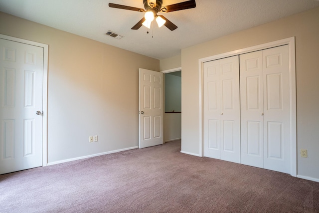 2521 Crosstimbers St Unit G3, Huntsville, TX 77320 - unfurnished bedroom with carpet, baseboards, a closet, and a ceiling fan
